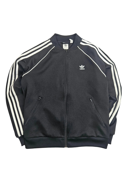 Adidas Trackjacke in Schwarz für Damen, sportlich, mit Reißverschluss und Markenlogo, ideal für Freizeit und Sport.